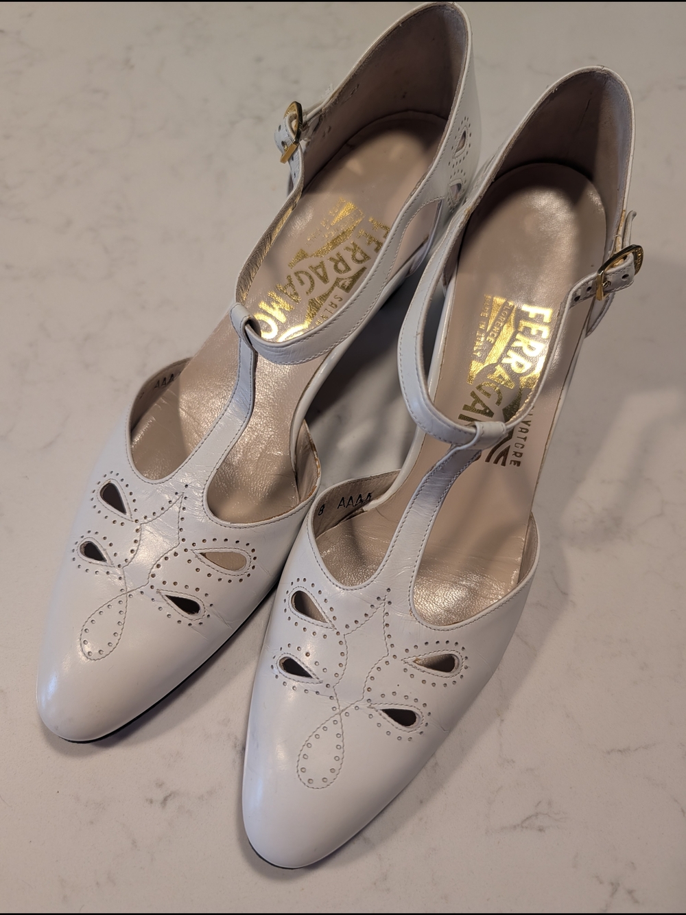 Salvatore Ferragamo White Leather T-Strap Pumps with Gold Buckle